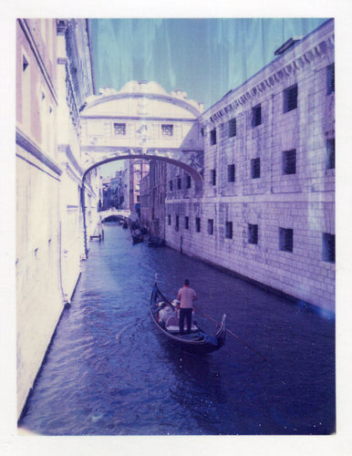 Polaroid of a gondola in a Venice canal