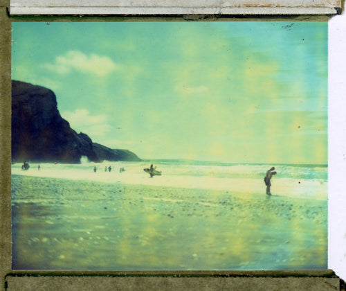 Polaroid image of Surfers and beach gazers at Porthtowan 