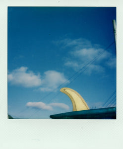 A single fin in the sun shot on Polaroid film