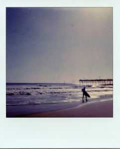 Surfer at Nags head pier shot on polaroid