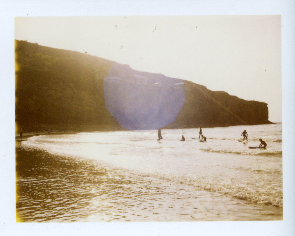 Polaroid image of sunset surfers at St Agnes