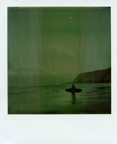 Polaroid image of people at the waters edge