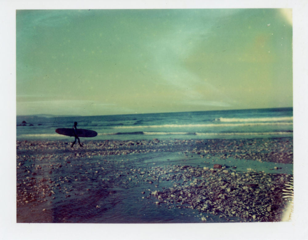 Polaroid of a longboarder at Porthtowan