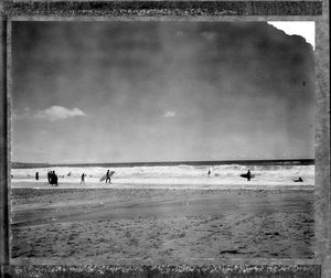 Polaroid of surfers at Porthtowan on a summers day