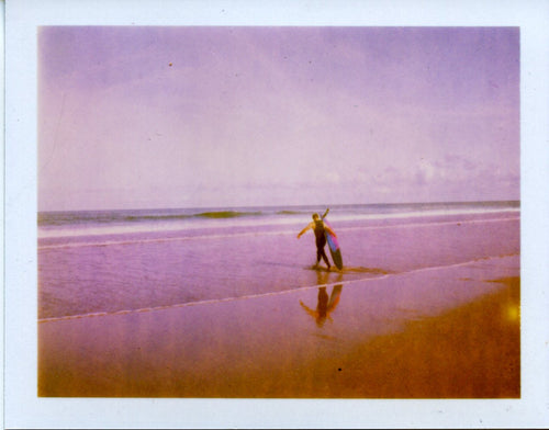 polaroid image of a longboard and reflection 