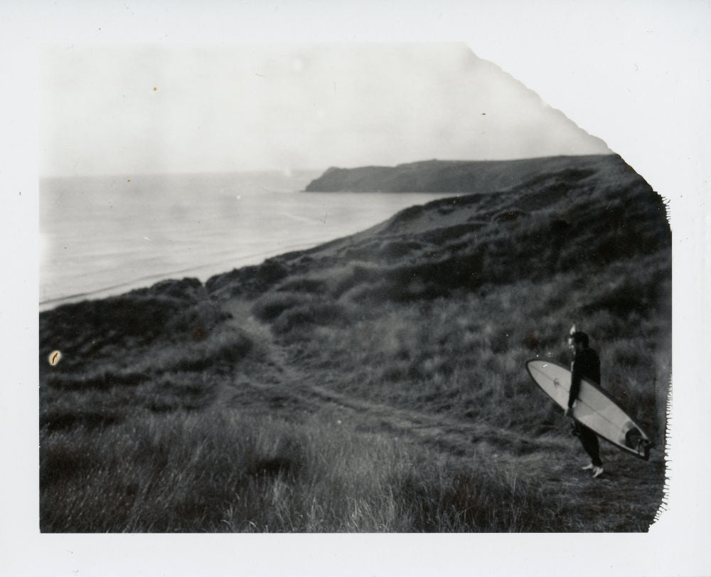 Polaroid image of a surfer in the dunes at Perran Sands