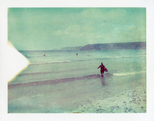 surfer on expired polaroid film at Sennen