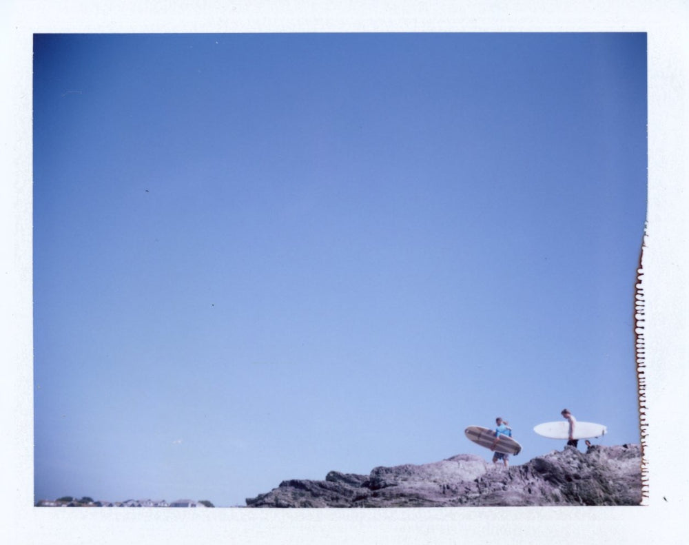 Surfers on tristram cliff shot on polaroid 